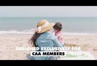 Woman and child sitting on a beach