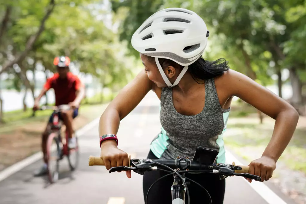 Cyclist look over their shoulder at cycling partner