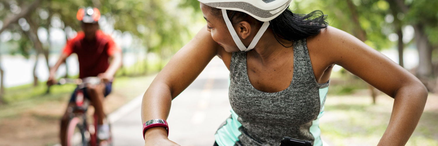 Cyclist look over their shoulder at cycling partner