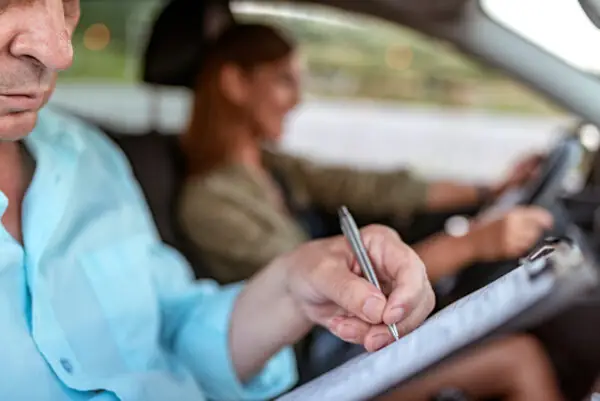 Driving instructor with checklist