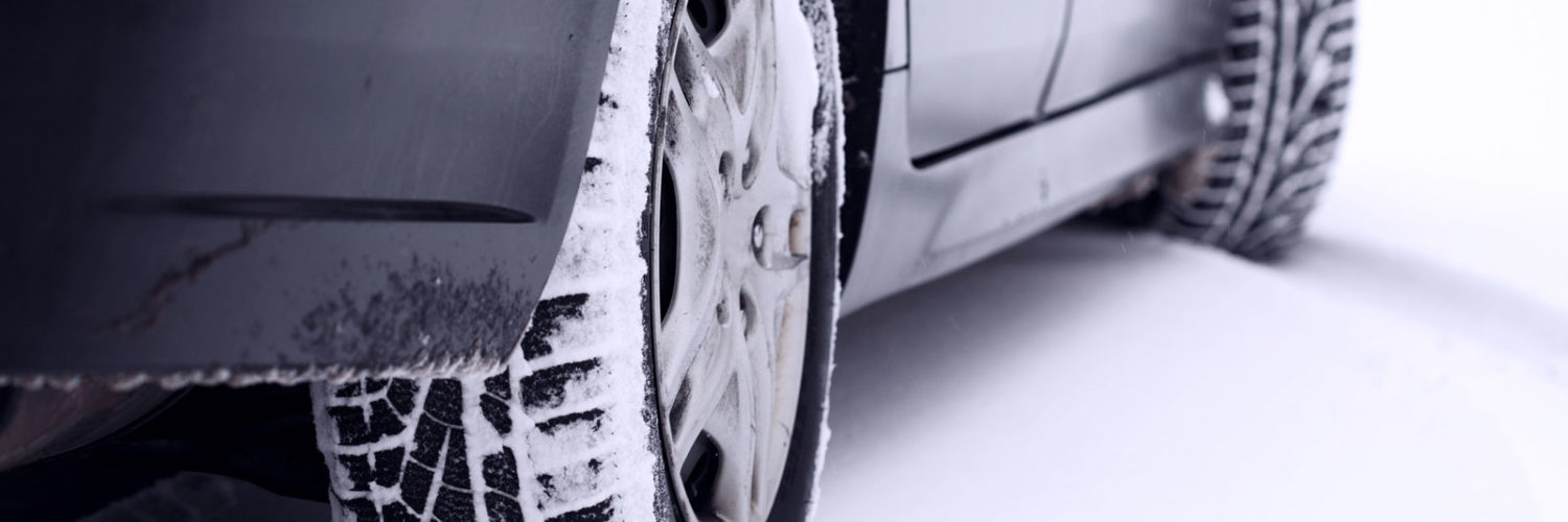 Vehicle winter tires on a snowy road