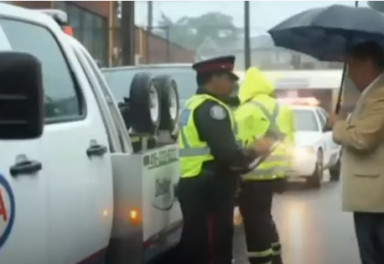 Tow truck with police officer and driver